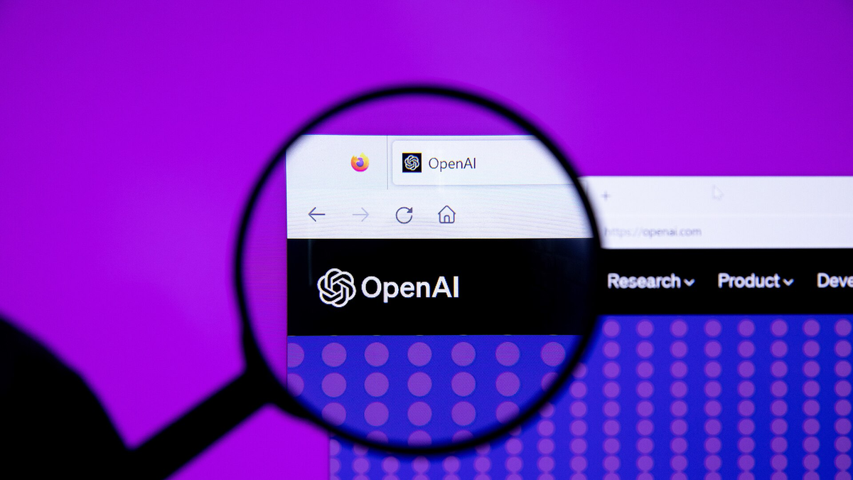 OpenAI logo with magnifying glass (52916339167)